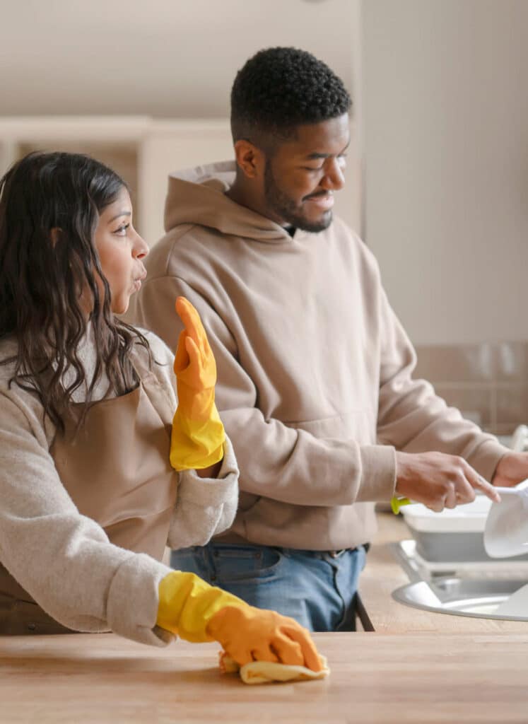 A young couple cleaning their sober living in orange county home.